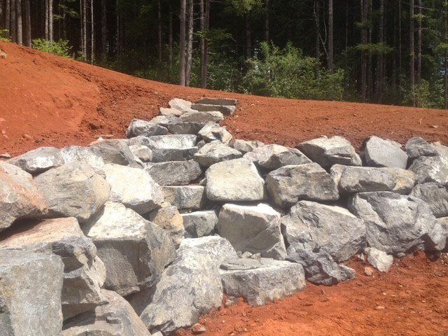 Huge Rocks as Retaining Wall — Eugene, OR — Braun Excavating Inc.