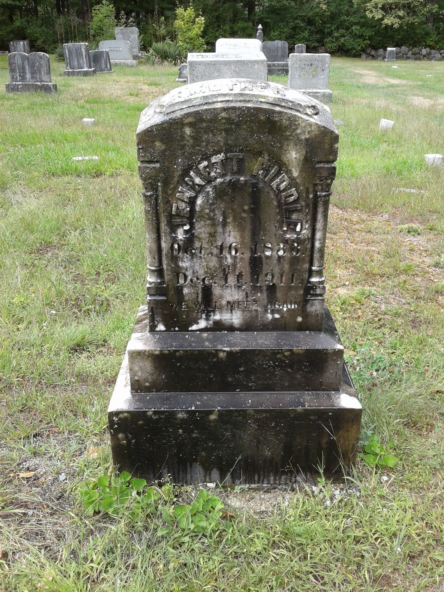 blackened unreadable headstone