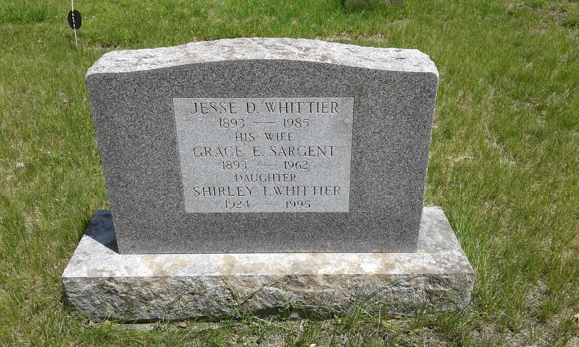 back of headstone with lichen cleaned off
