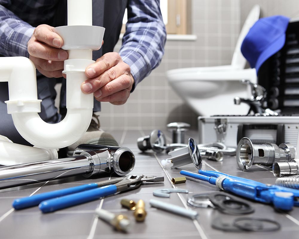 Man Repairing Lavatory Sink