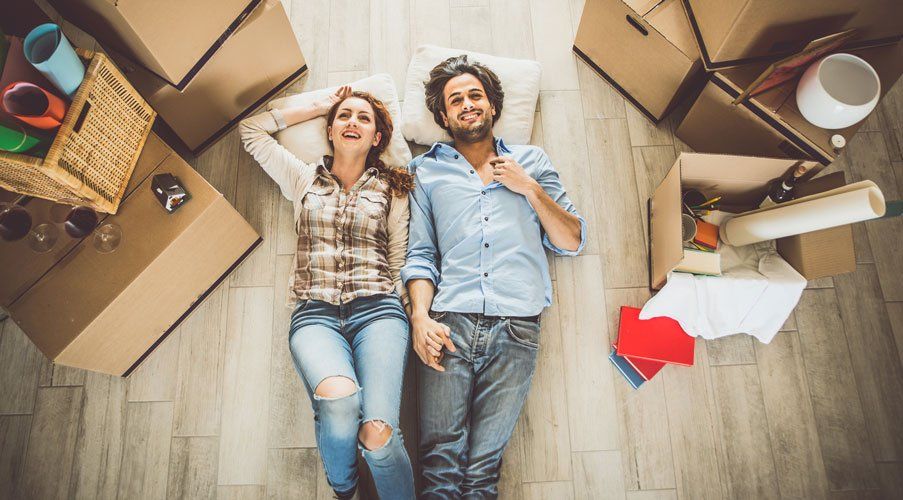 couple on floor with moving boxes