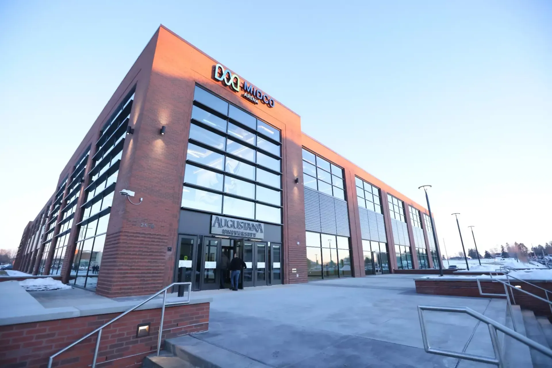 A large brick building with stairs leading up to it