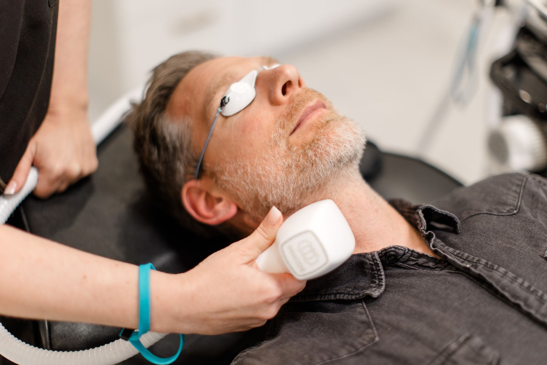 man getting laser hair removal
