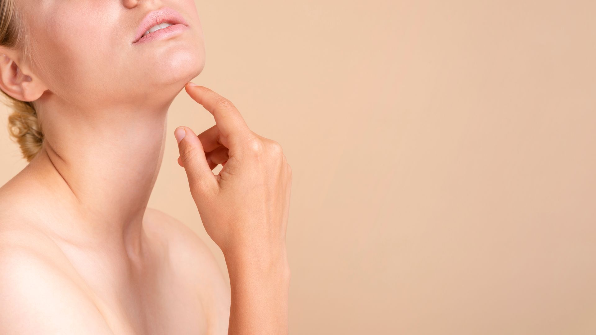 a woman touching her chin