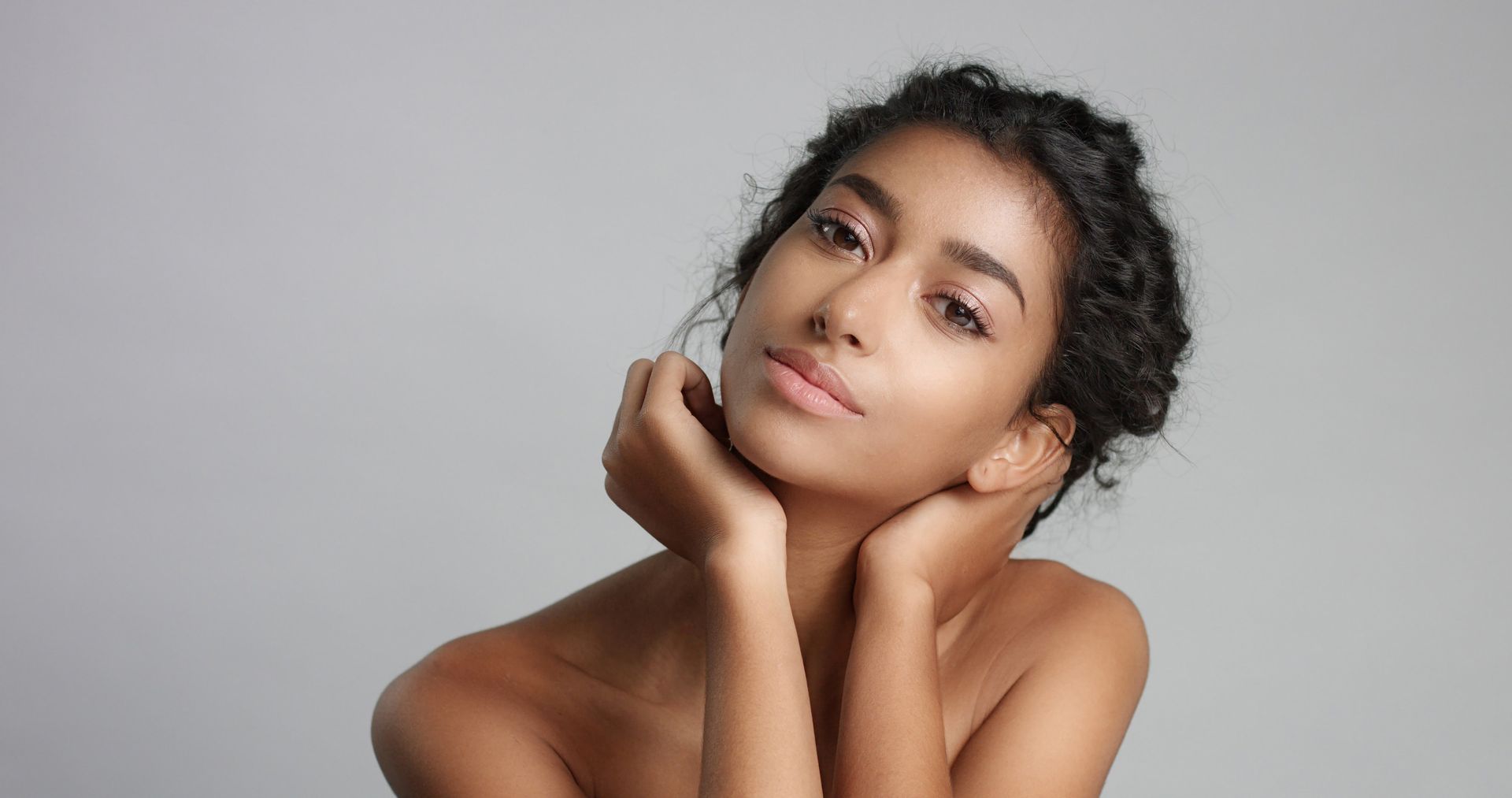 a woman touching her face