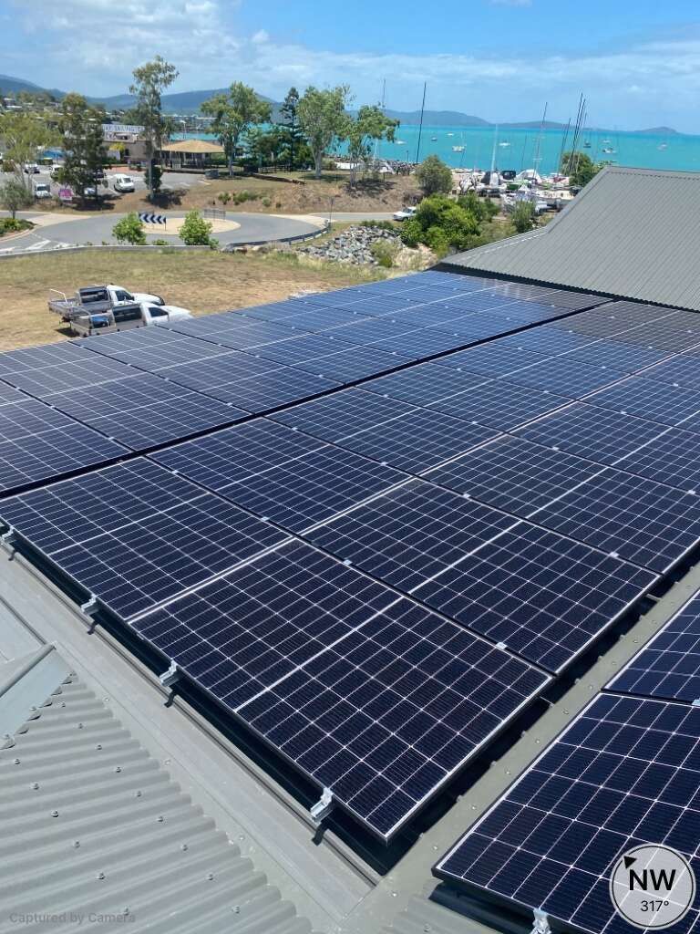 Solar Panels On Roof And The Sea In the Background — Solar Power Whitsunday In Airlie Beach, QLD