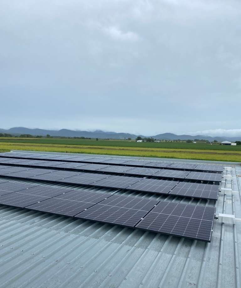 A Row Of Solar Panels Are Sitting On Top Of A Metal Roof — Solar Power Whitsunday In Proserpine, QLD