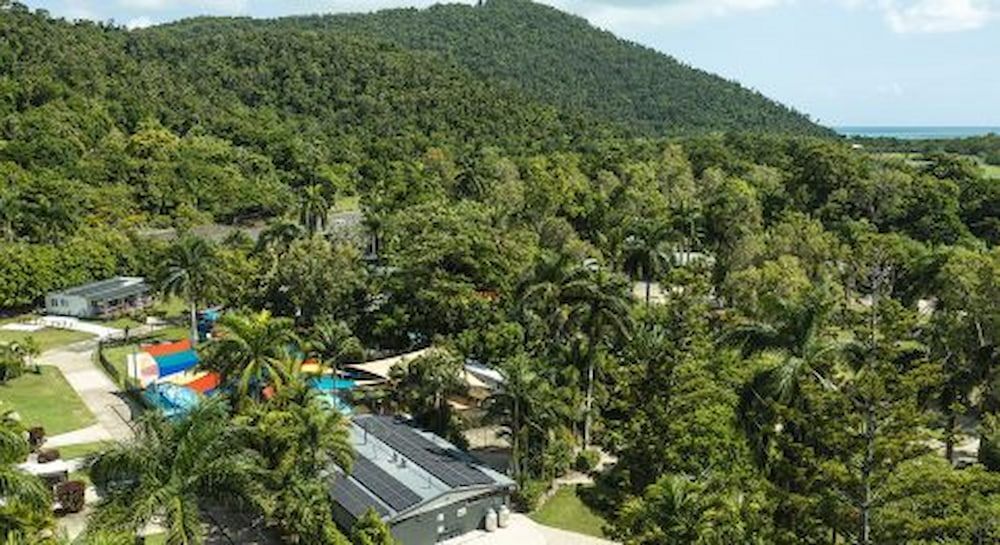An Aerial View Of A House In The Middle Of A Lush Green Forest — Solar Power Whitsunday In Airlie Beach, QLD