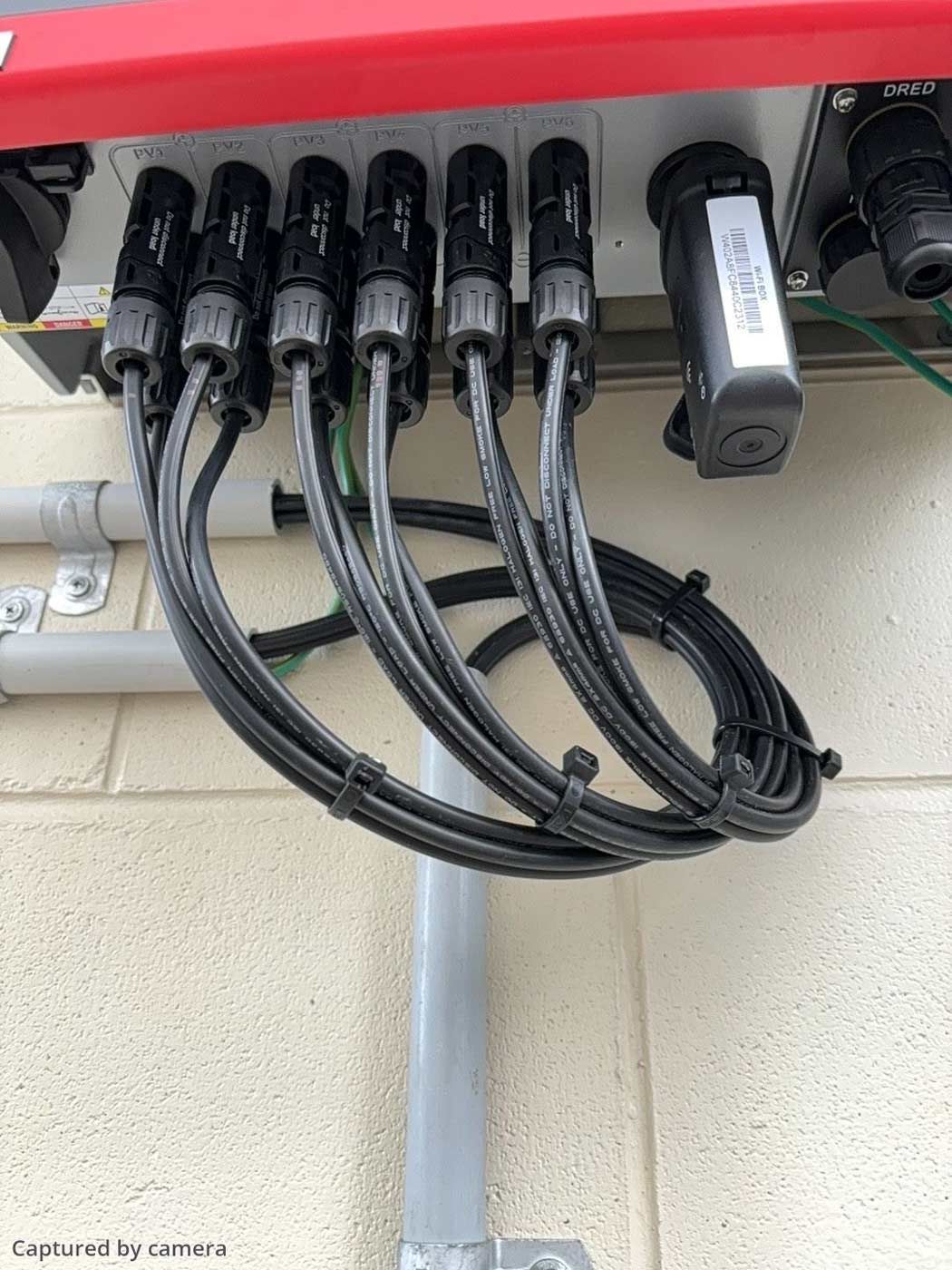A Bunch of Wires Are Connected to a Solar Inverter — Solar Power Whitsunday In Proserpine, QLD