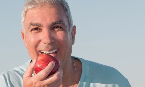 man eating an apple