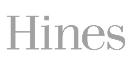 Gray serif word “Hines” on a white background