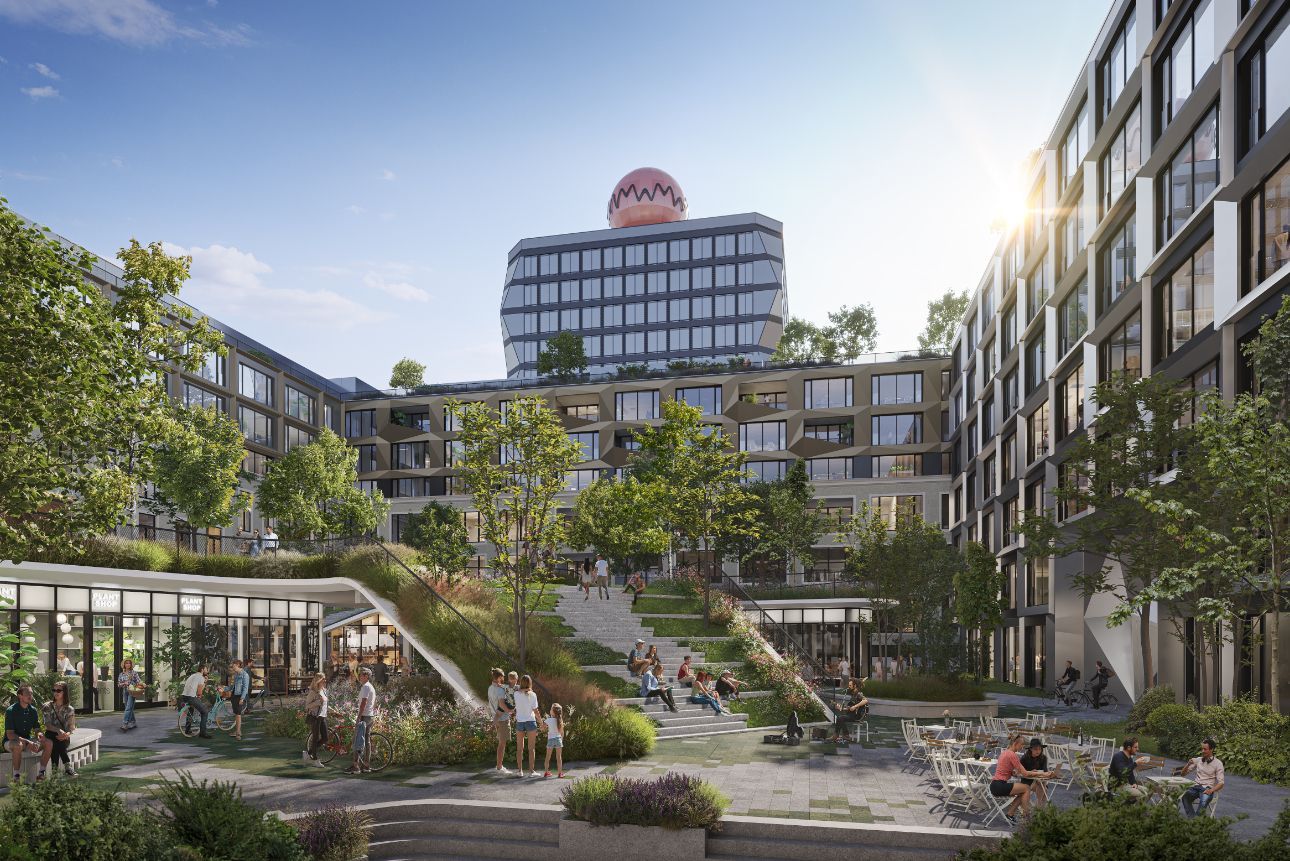 Modern courtyard between apartment buildings with greenery, pathways, and people relaxing in the sun