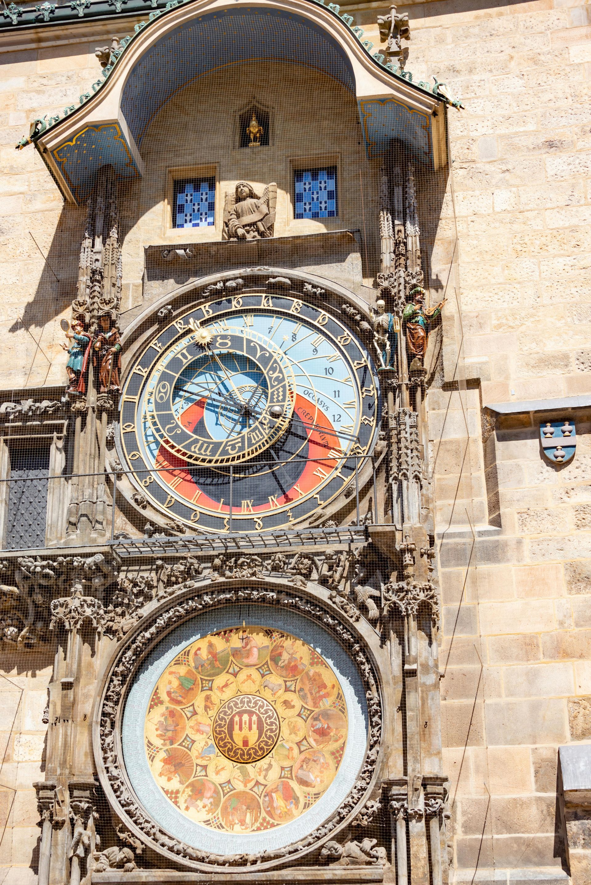 Astronomical clock in Prague, Czech Republic; blue and red dial, ornate details.