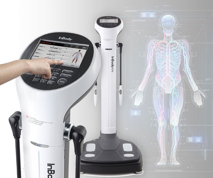 Medical body composition scanner with touchscreen and full-body display, showing a human anatomy graphic
