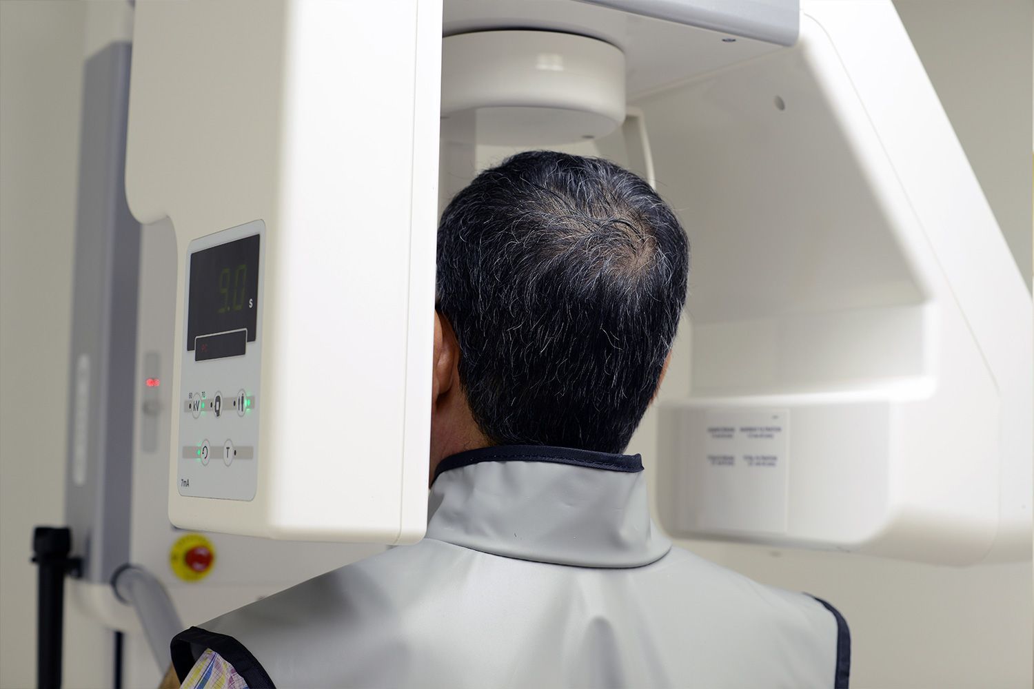 A man is getting an x-ray of his head.