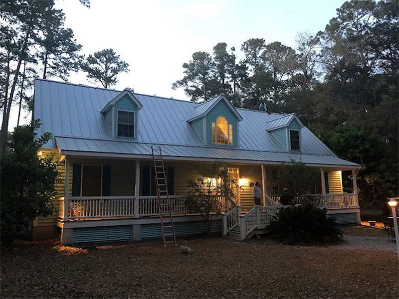 A house with a ladder on the front porch
