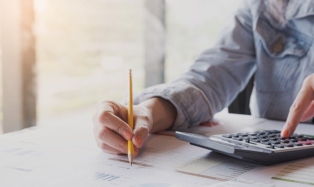 Woman Hand Holding A Pencil — Hot Springs, AR — Malone Tax & Bookkeeping