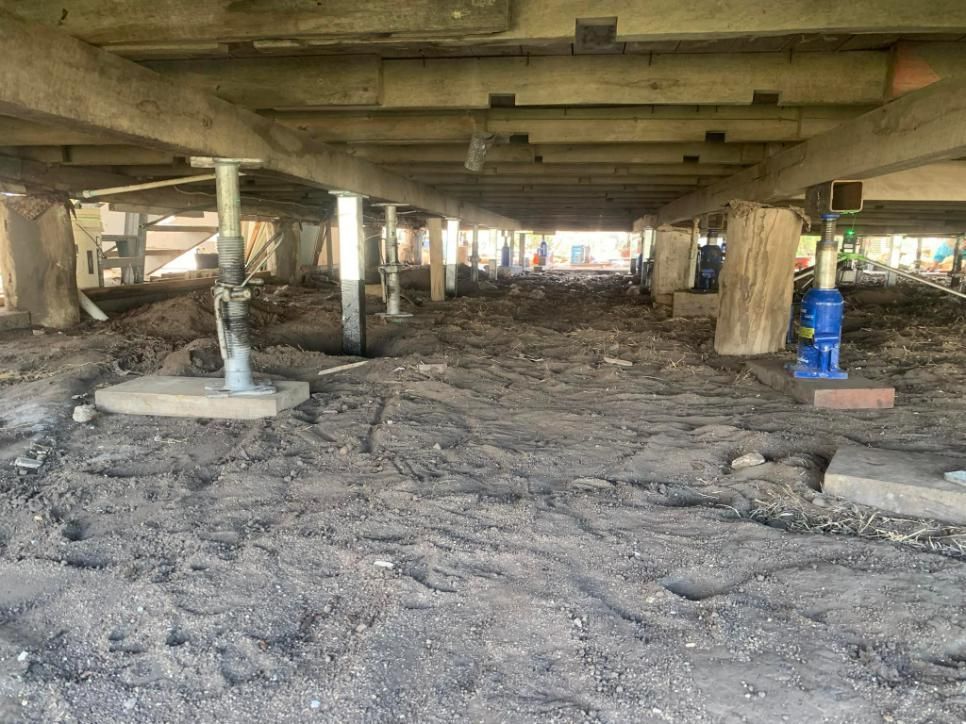 The Foundation of A House Is Being Built Underneath a Bridge — Get Stumped Stumping & Maintenance In Collinsville, QLD