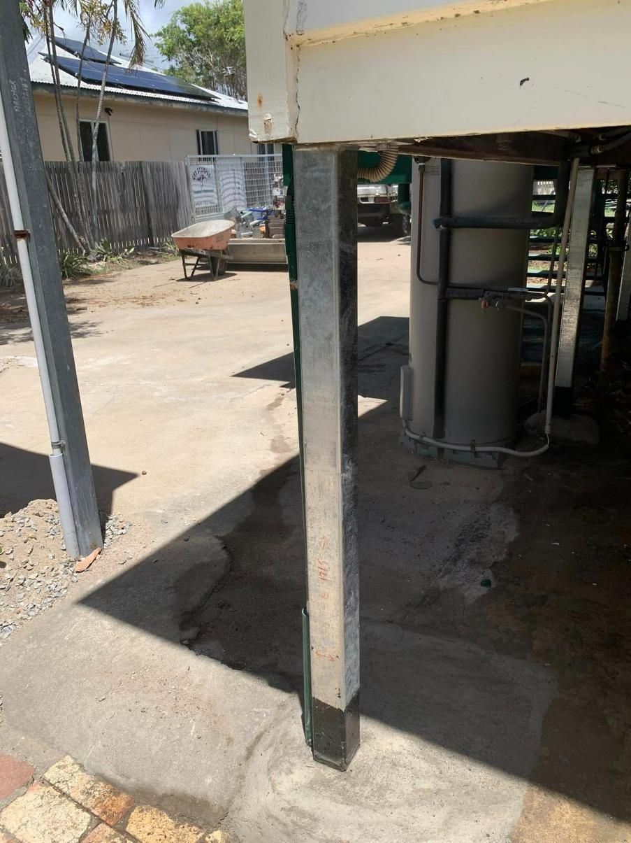 A Metal Pole with A Water Heater Attached to It — Get Stumped Stumping & Maintenance In Bowen, QLD