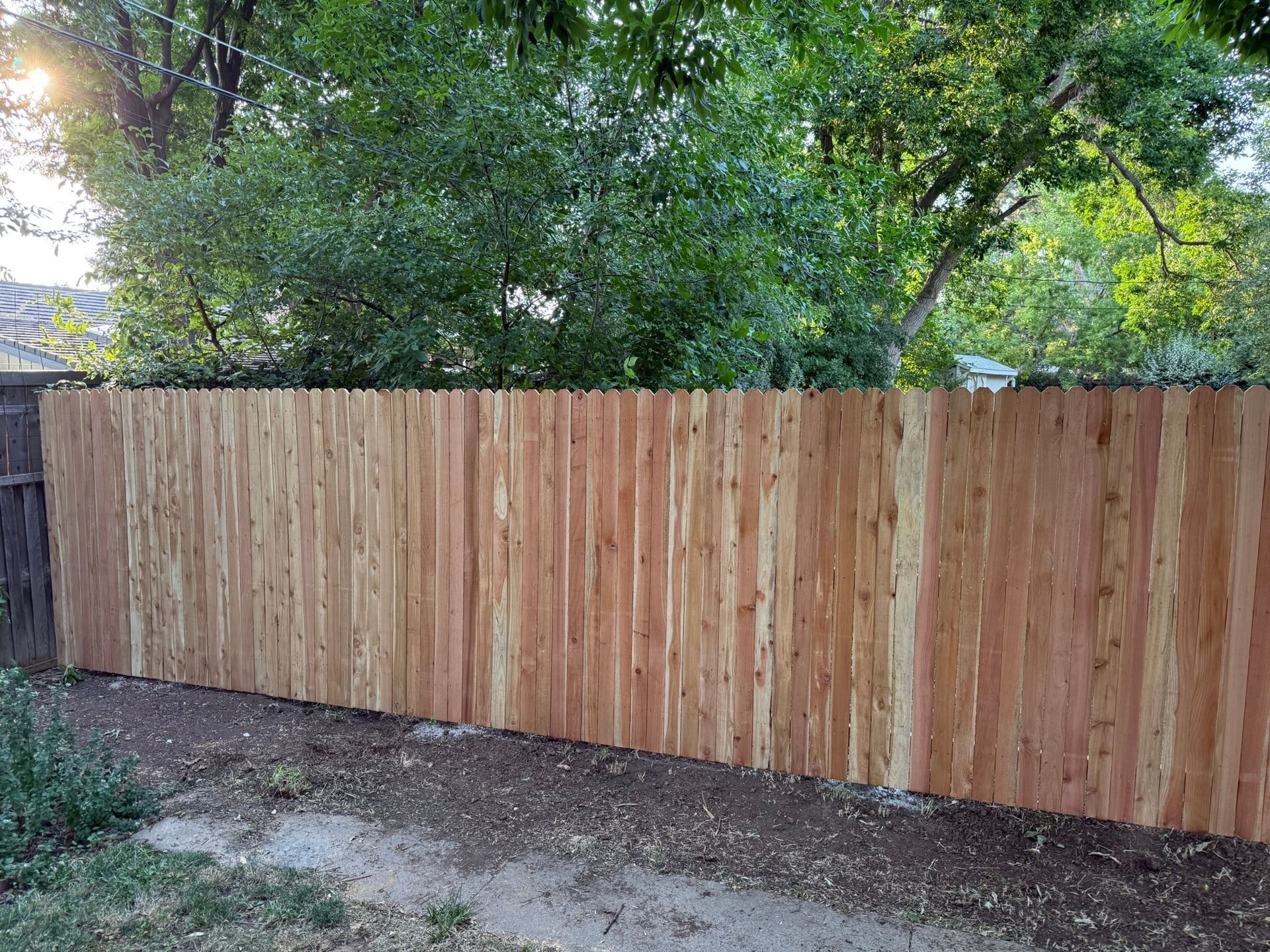 beautiful privacy fence that replaced a chain link fence