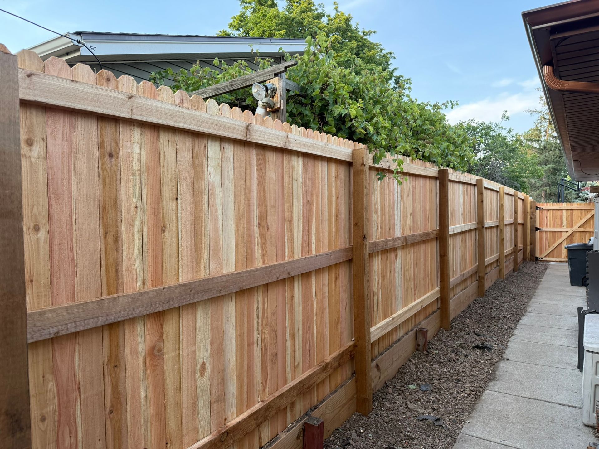 backside of fence with retaining wall