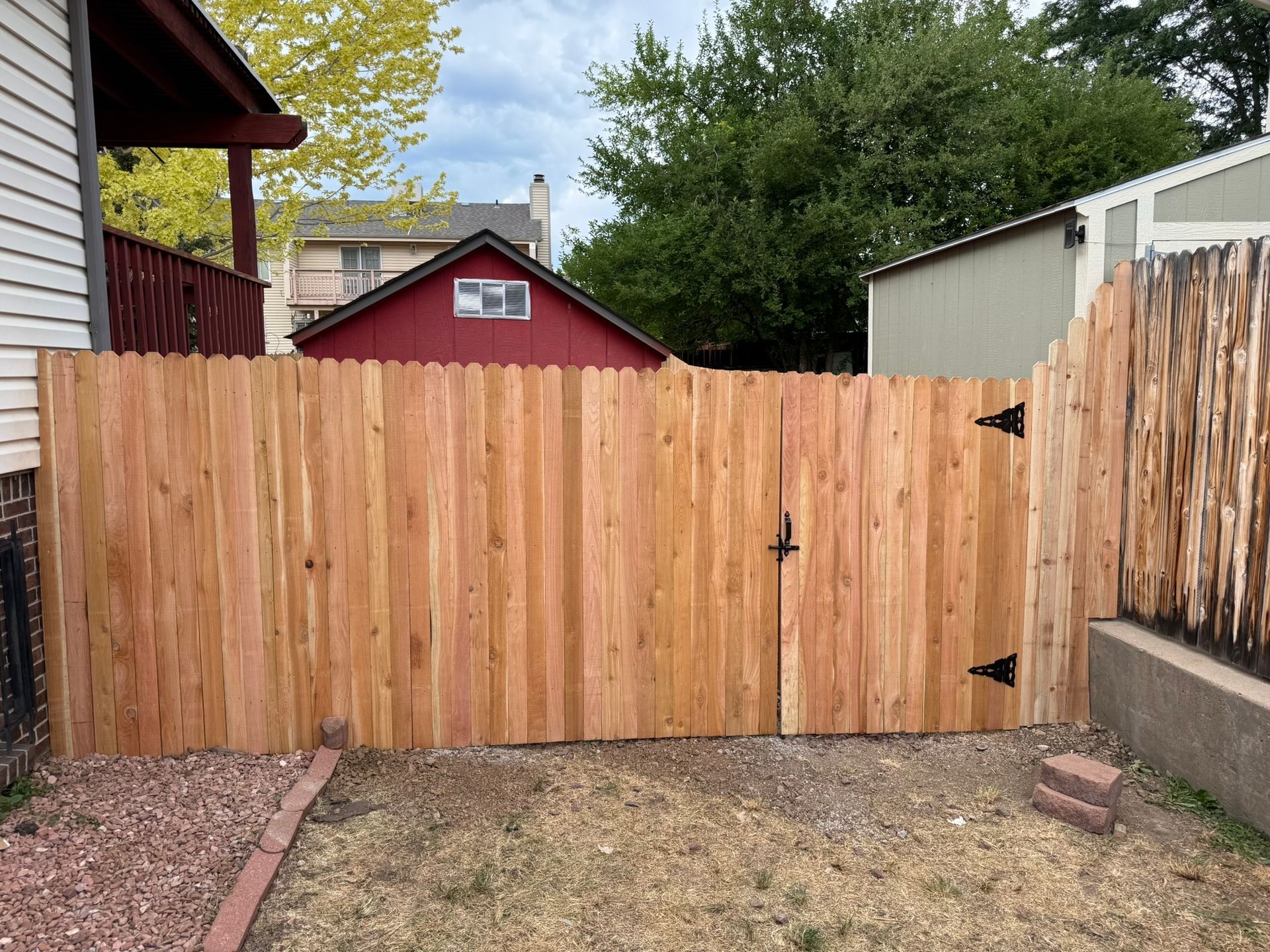 front of gate with barn in background from right side