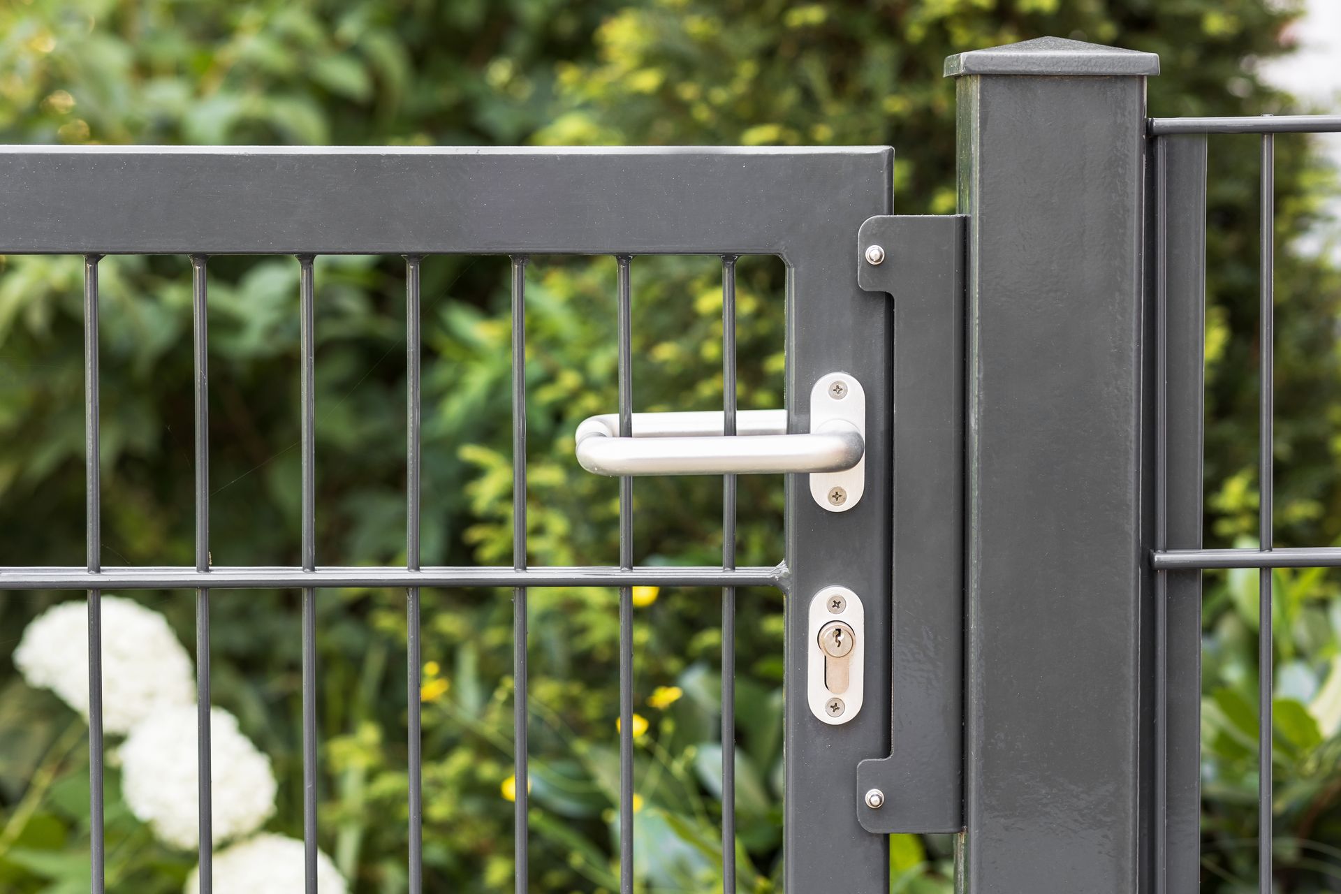 A close up of a gate with a handle on it.