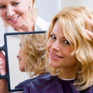 Hairdresser Holding Mirror for Woman - Hair Salon in Manville, NJ
