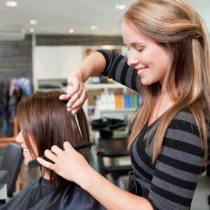 Hairdresser Cutting Client's Hair - Beauty Salon in Manville, NJ