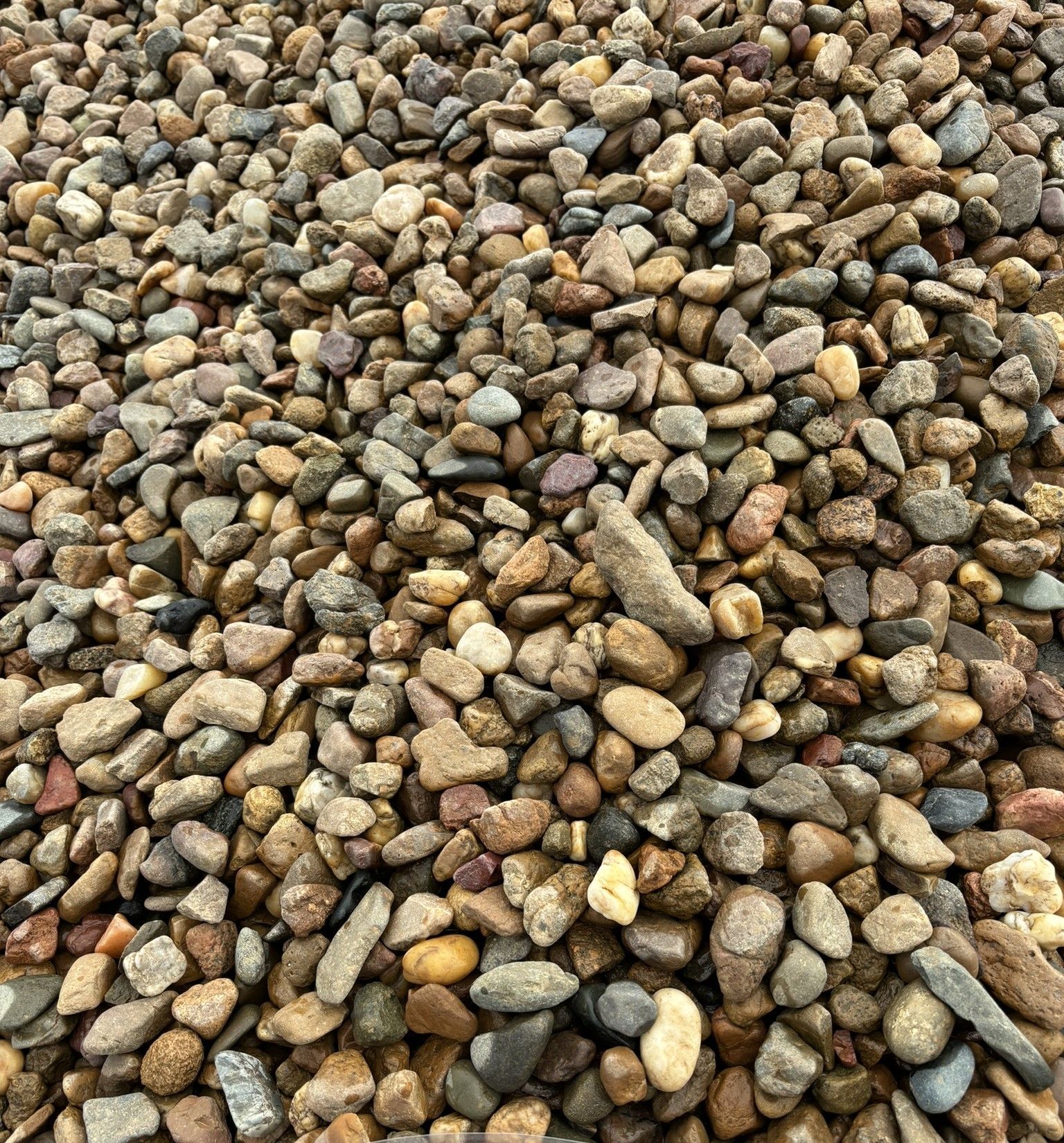 A Pile Of Gravel Is Sitting On The Ground — McCahills Earthmoving & Landscaping Supplies In Stuart, QLD