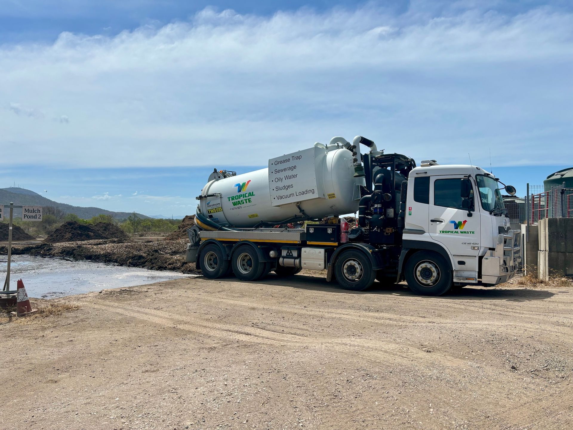 Tropical Waste Truck Dumping Waste — McCahills Earthmoving & Landscaping Supplies In Stuart, QLD