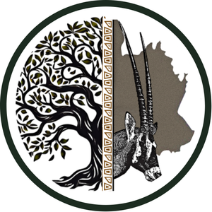 A circle with a tree and an antelope in it