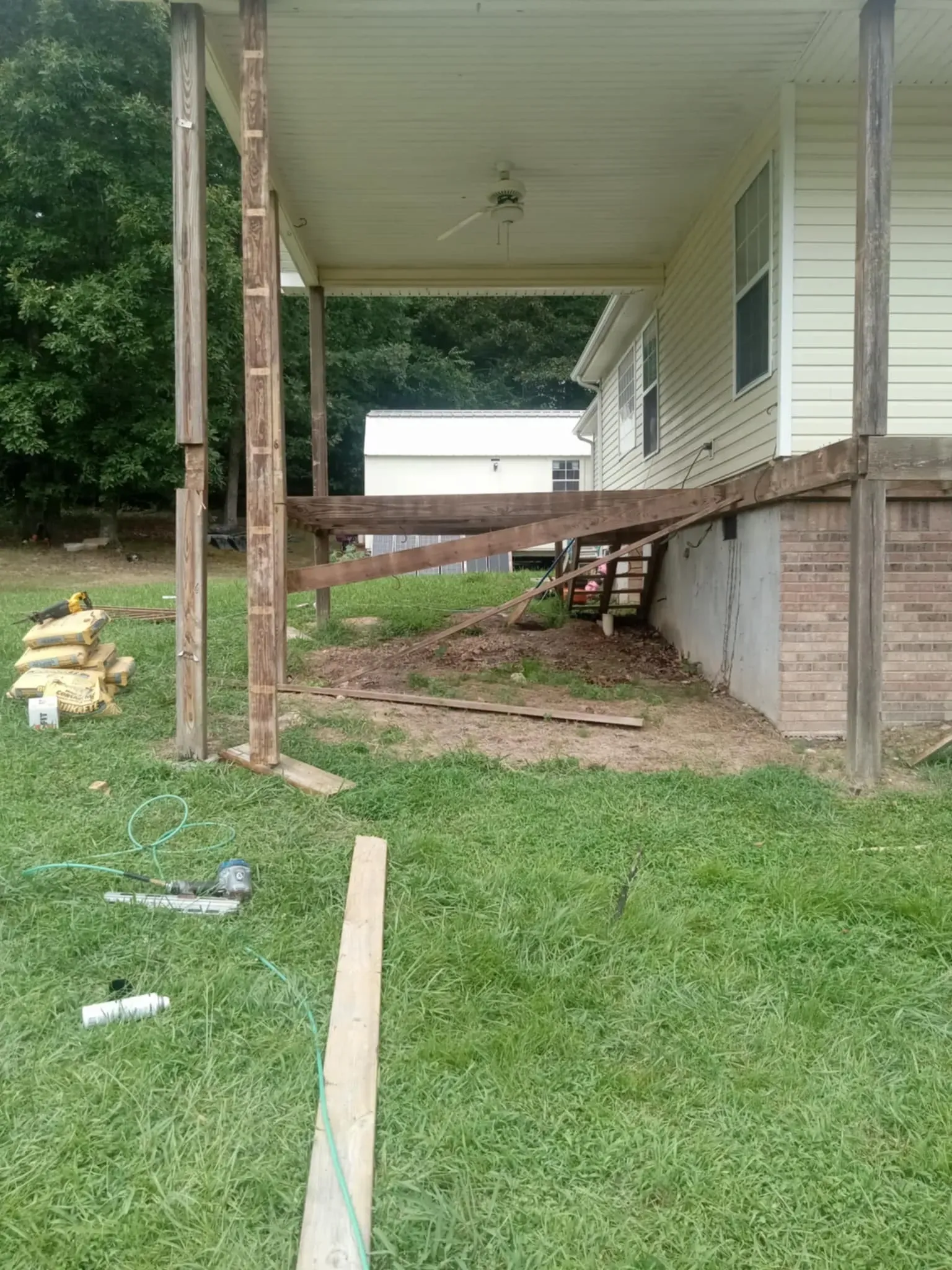 A porch is being built on the side of a house.