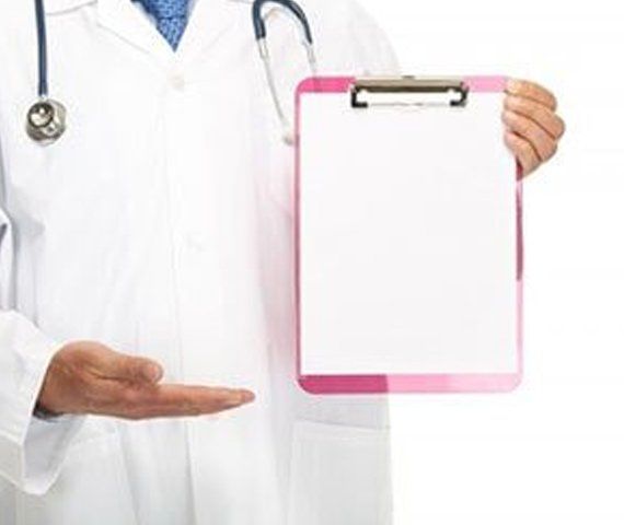 A Doctor With A Clip Board | Hampden Medical Group | Englewood, Colorado