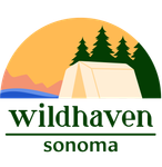 The  logo for Wildhaven Sonoma with tent in front of river with trees, mountains, and sunset in background