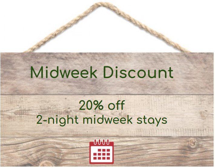 A wooden sign that says midweek discount 20 % off 2 night midweek stays