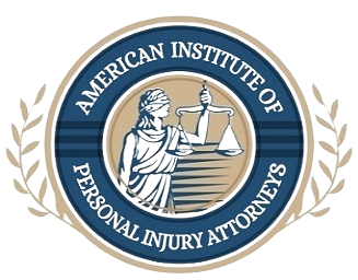 Logo for American Institute of Personal Injury Attorneys featuring Lady Justice with scales.
