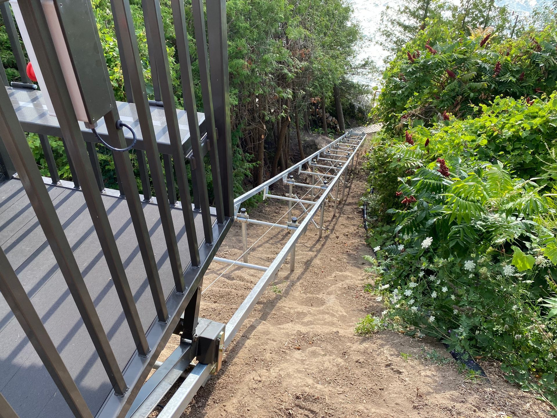 Hillside Tram System on a hill installed by Cobble Design