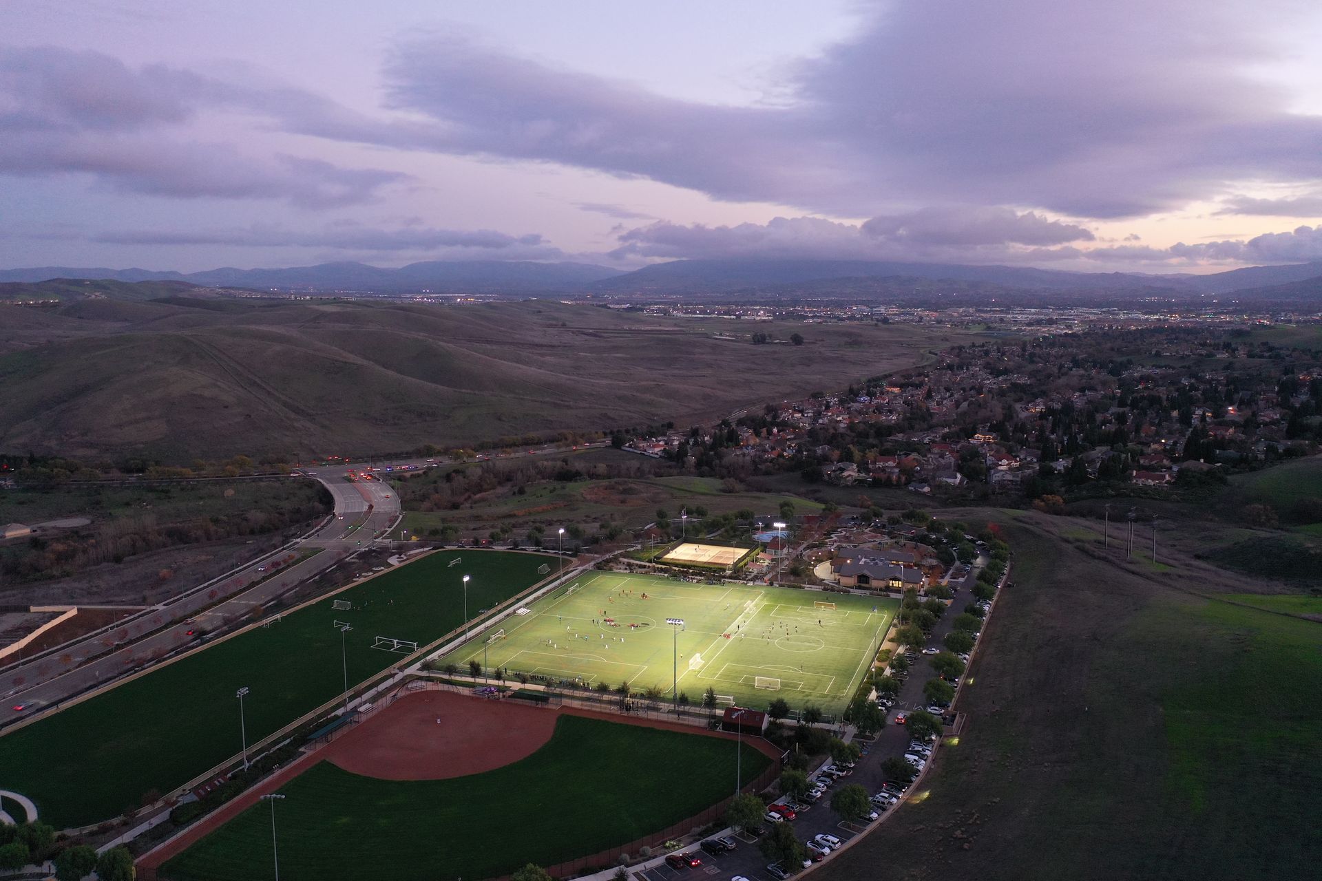 An aerial view of a baseball field and a soccer field.