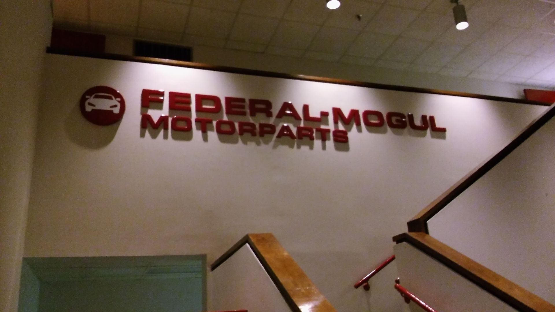 Stairs leading up to a wall that says federal mogul motorparts