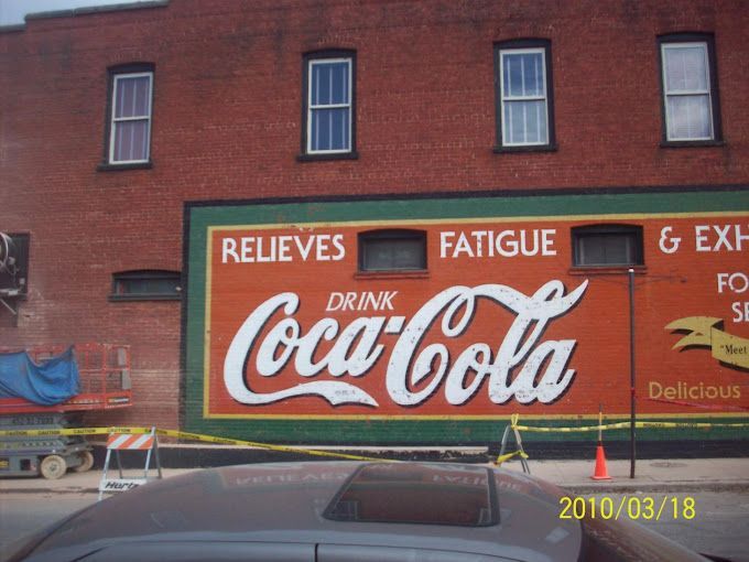 A brick building with a cross.