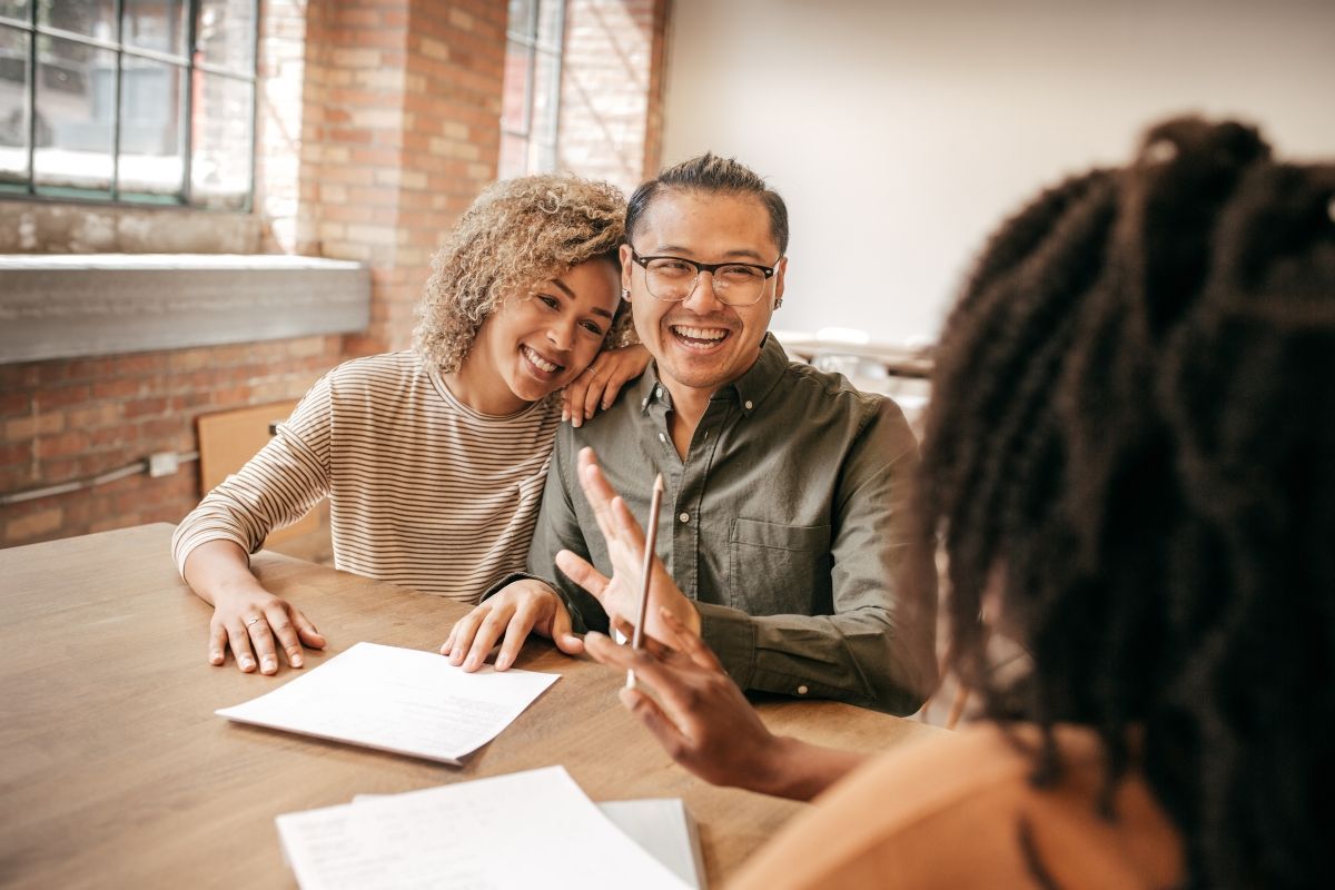 Couple speaking with mortgage planner about mortgage marketing