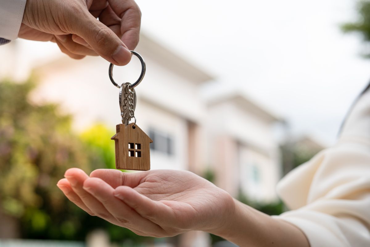 house keys being put in someone's hand