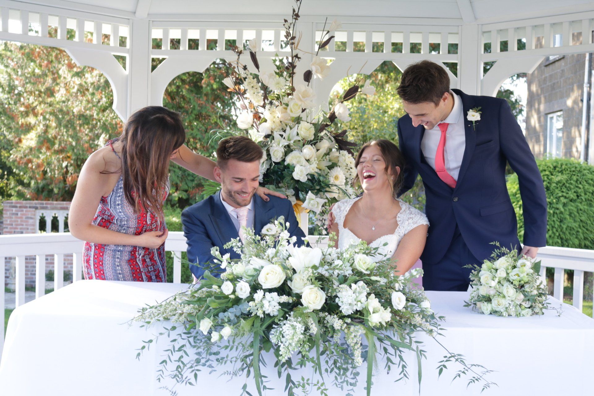 Bride and Groom signing the register in the wedding gazebo at the Shrubbery Hotel Ilminster