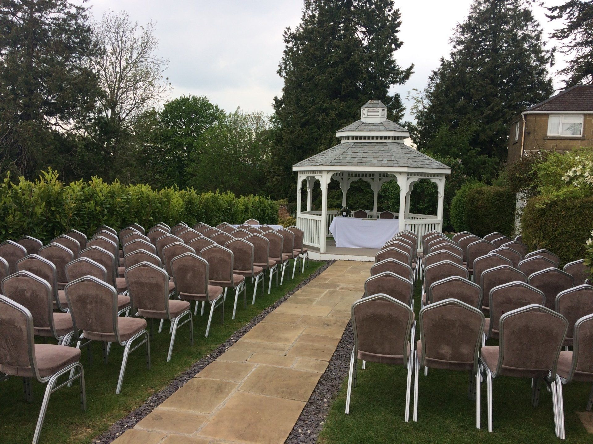 Bride and Groom signing the register in the wedding gazebo at the Shrubbery Hotel Ilminster