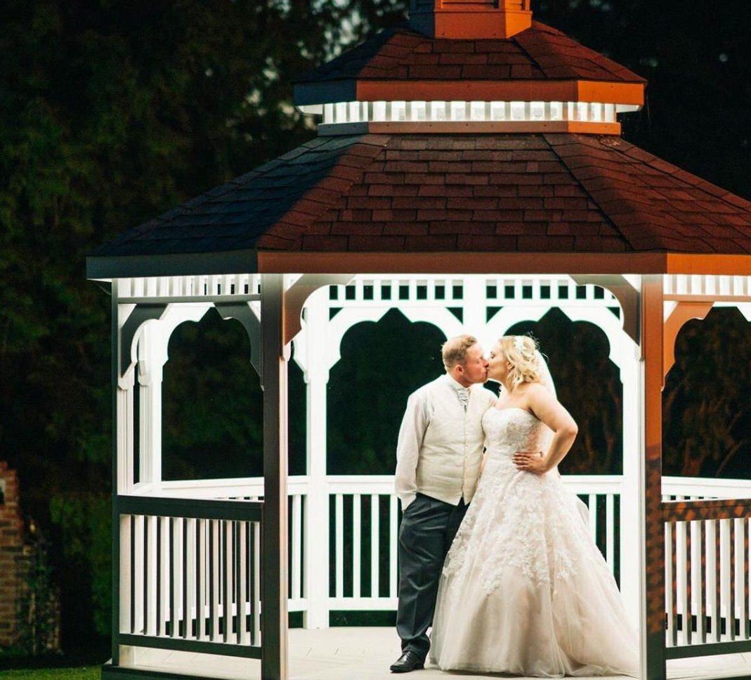 Wedding Couple in the wedding gazebo in Ilminster, Somerset, in the evening