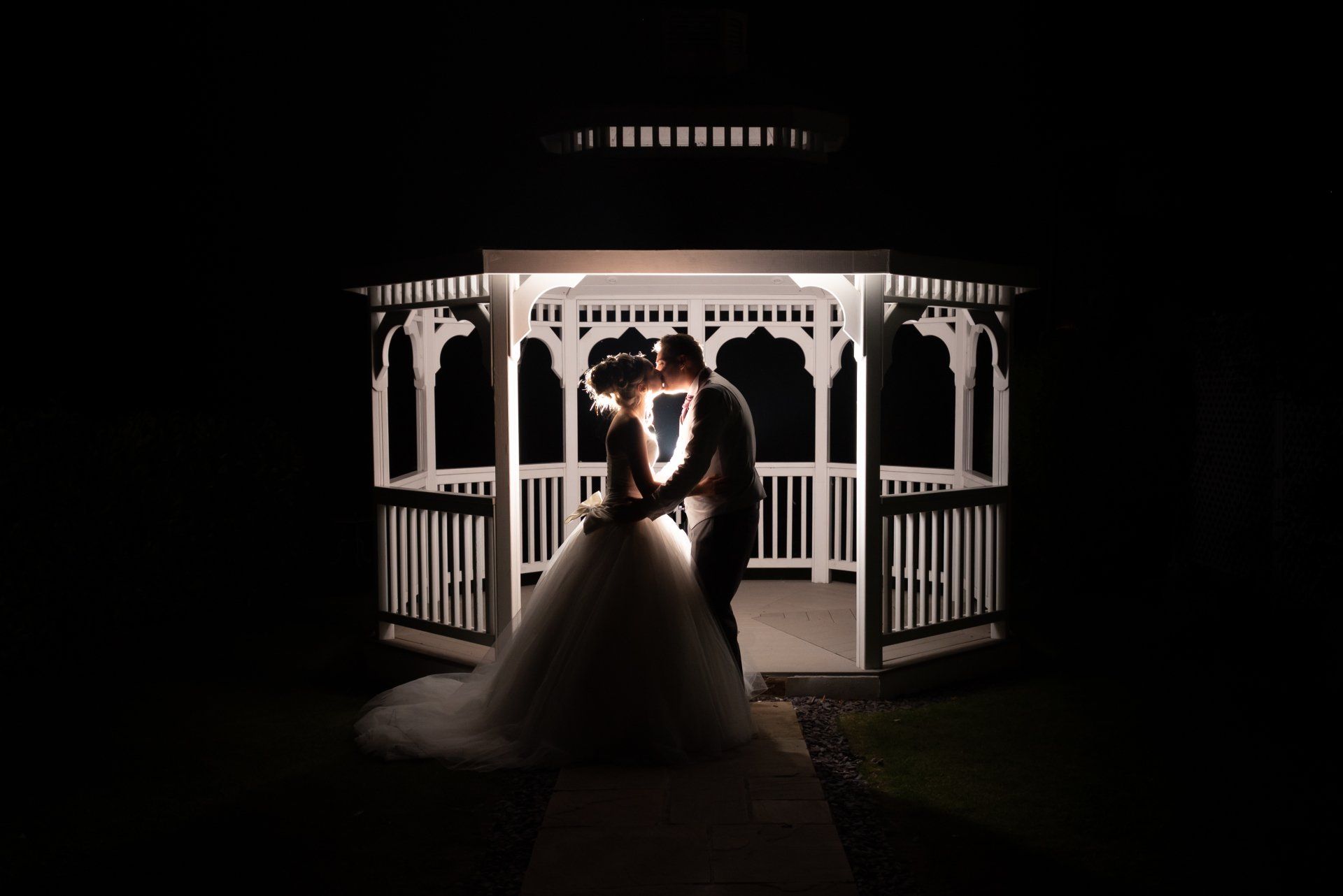Bride and Groom in the wedding gazebo in Ilminster, Somerset, at night time