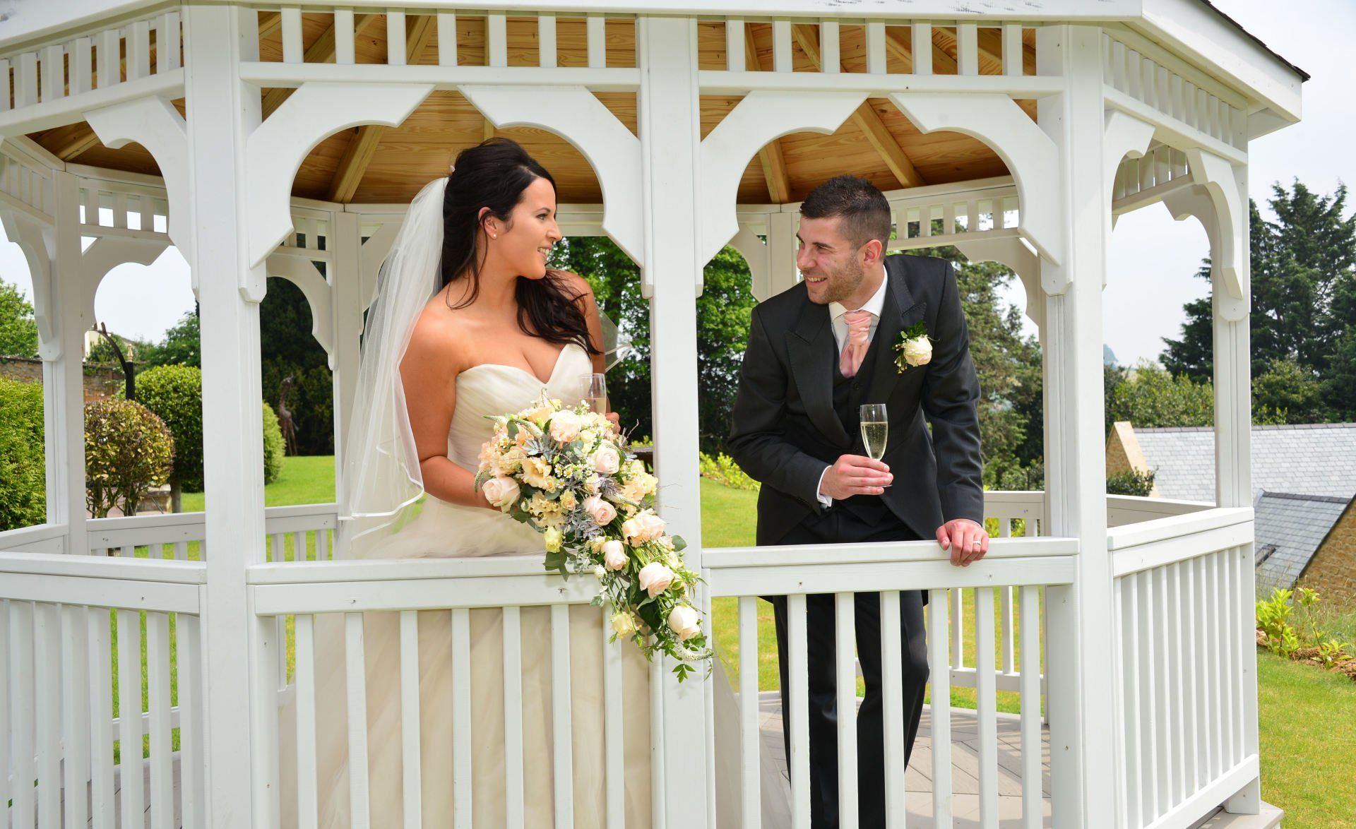 Bride and Groom in the wedding gazebo in Ilminster, Somerset, in the daytime