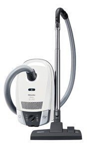 White Miele canister vacuum cleaner.