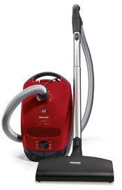 Red Miele canister vacuum cleaner.